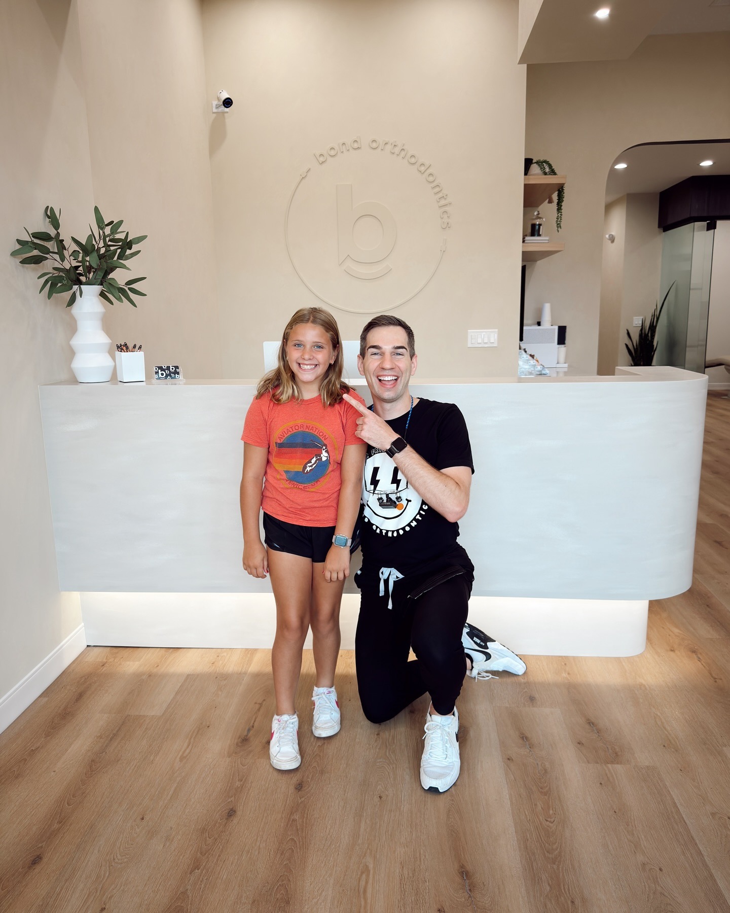 541510218_18325396861234559_306473879635734819_n Dr. Bond with a young patient after an orthodontic consultation.